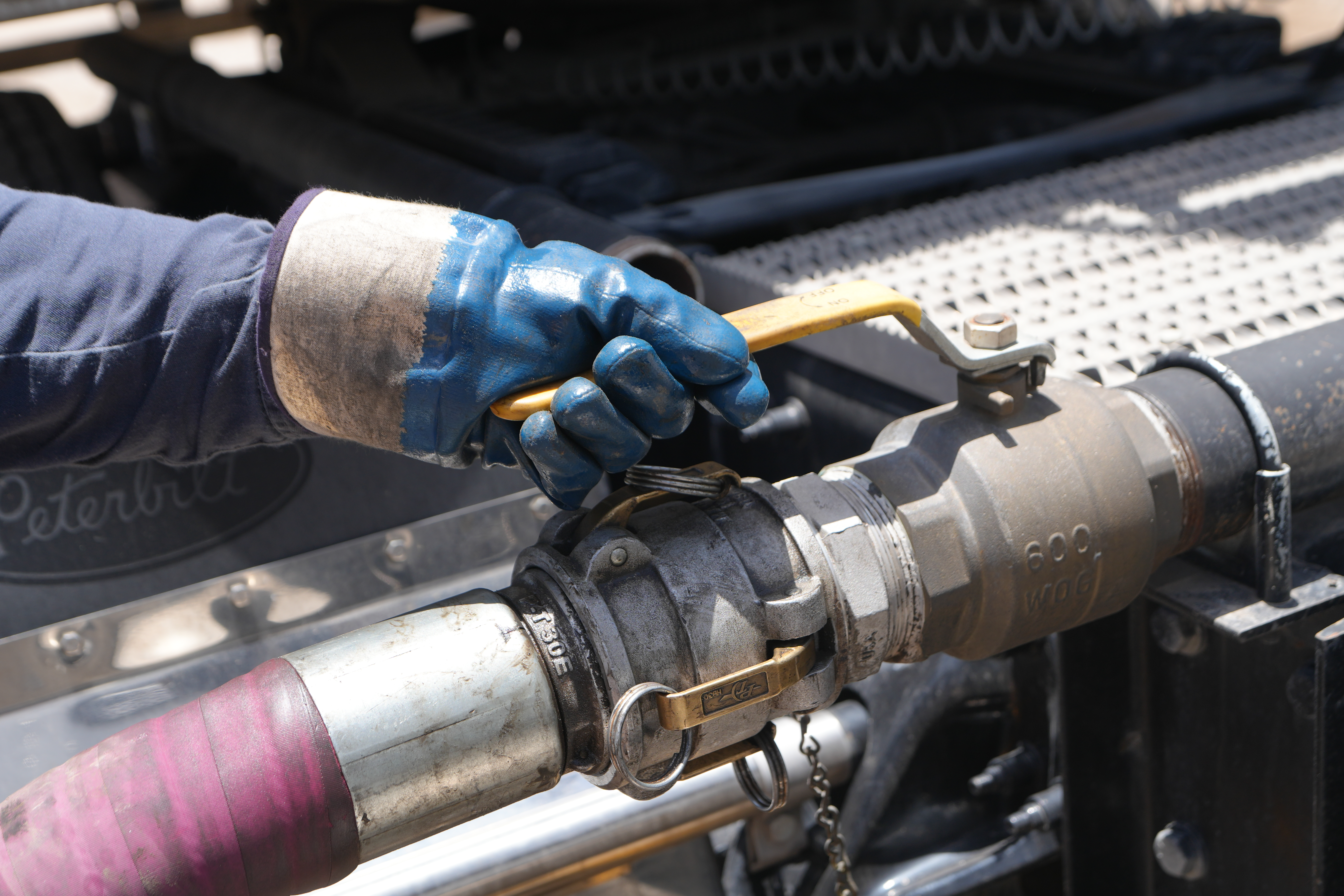 Anytime Fuel Pros delivery driver fueling diesel